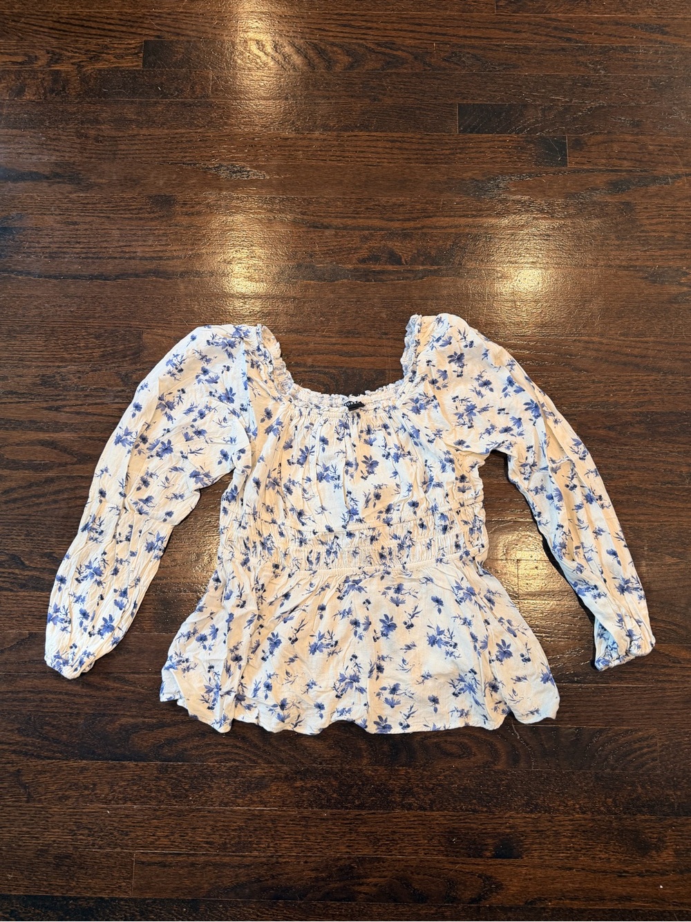 Blue Floral Smocked Peplum Long-Sleeve Top. Torrid.